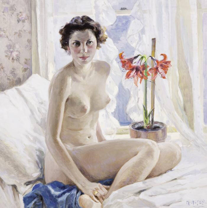 Nude brunette with Amaryllis flowers seated upon white bed.
